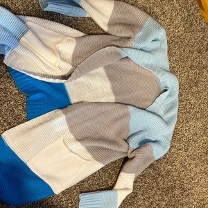 Light blue, grey, white, dark blue sweater